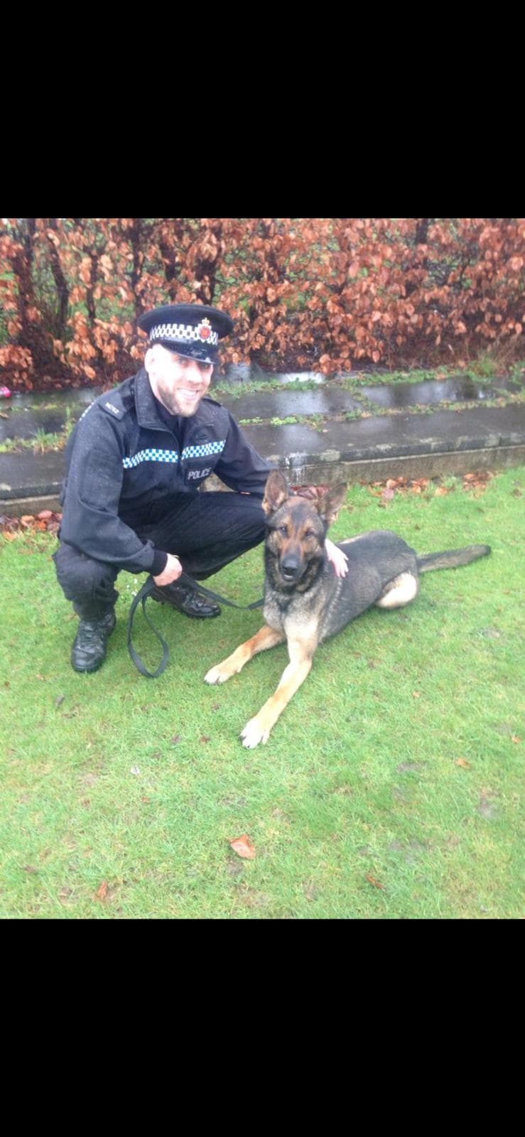 Paul in police uniform with his police dog